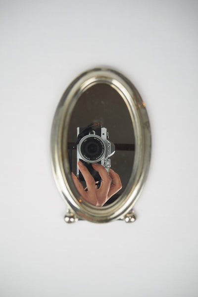 An Antique Silver Plate Framed Mirror. This antique silver plate mirror is perfect for your mantelpiece.