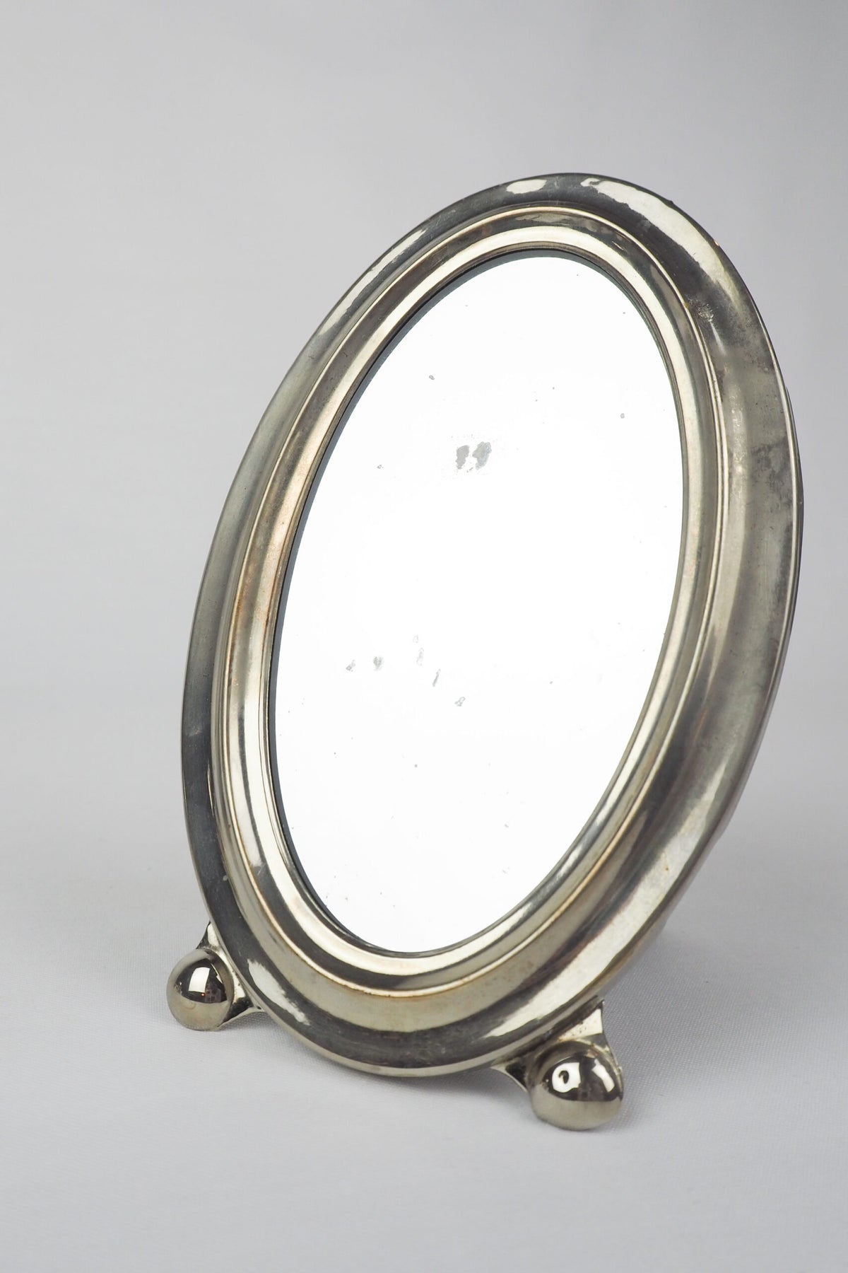 An Antique Silver Plate Framed Mirror. This antique silver plate mirror is perfect for your mantelpiece.