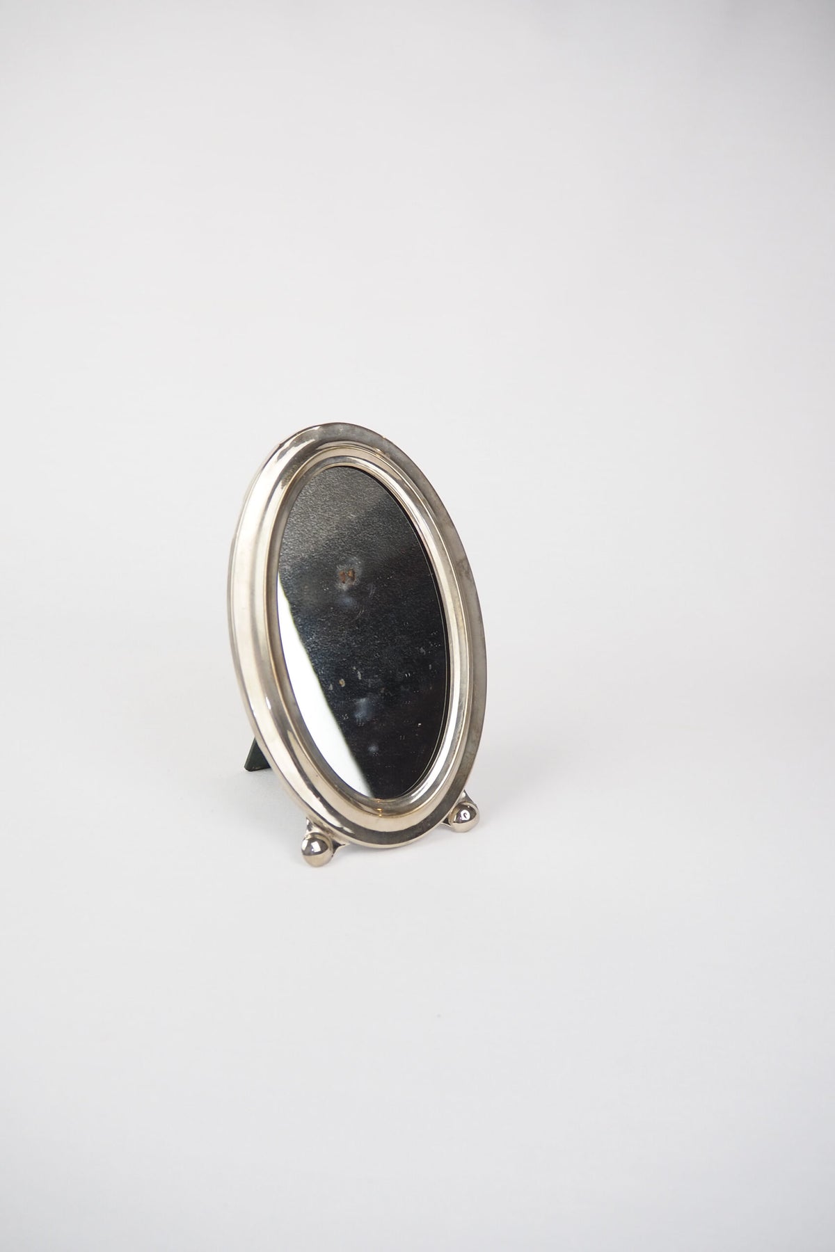 An Antique Silver Plate Framed Mirror. This antique silver plate mirror is perfect for your mantelpiece.