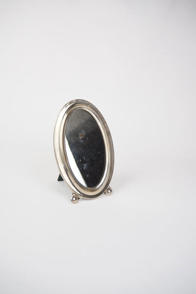 An Antique Silver Plate Framed Mirror. This antique silver plate mirror is perfect for your mantelpiece.
