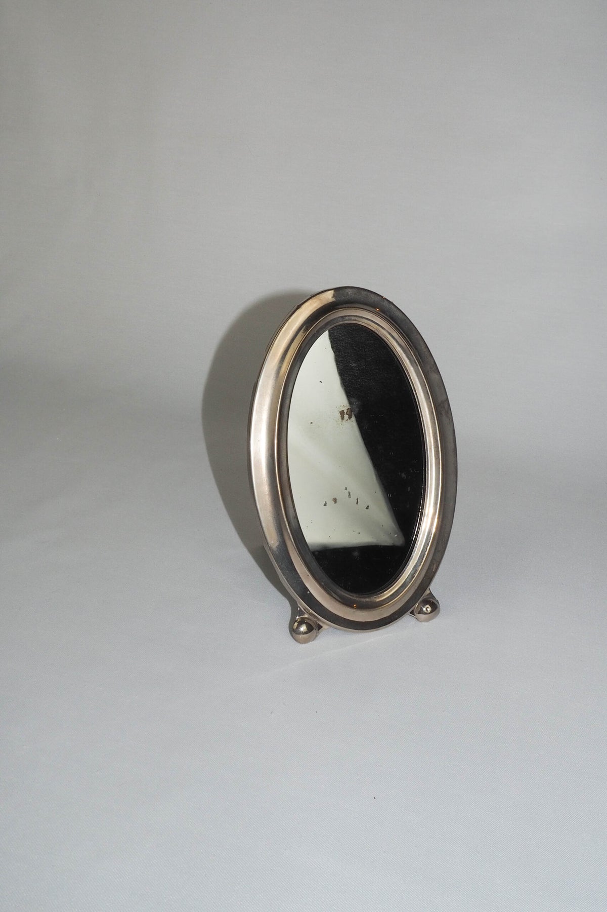 An Antique Silver Plate Framed Mirror. This antique silver plate mirror is perfect for your mantelpiece.