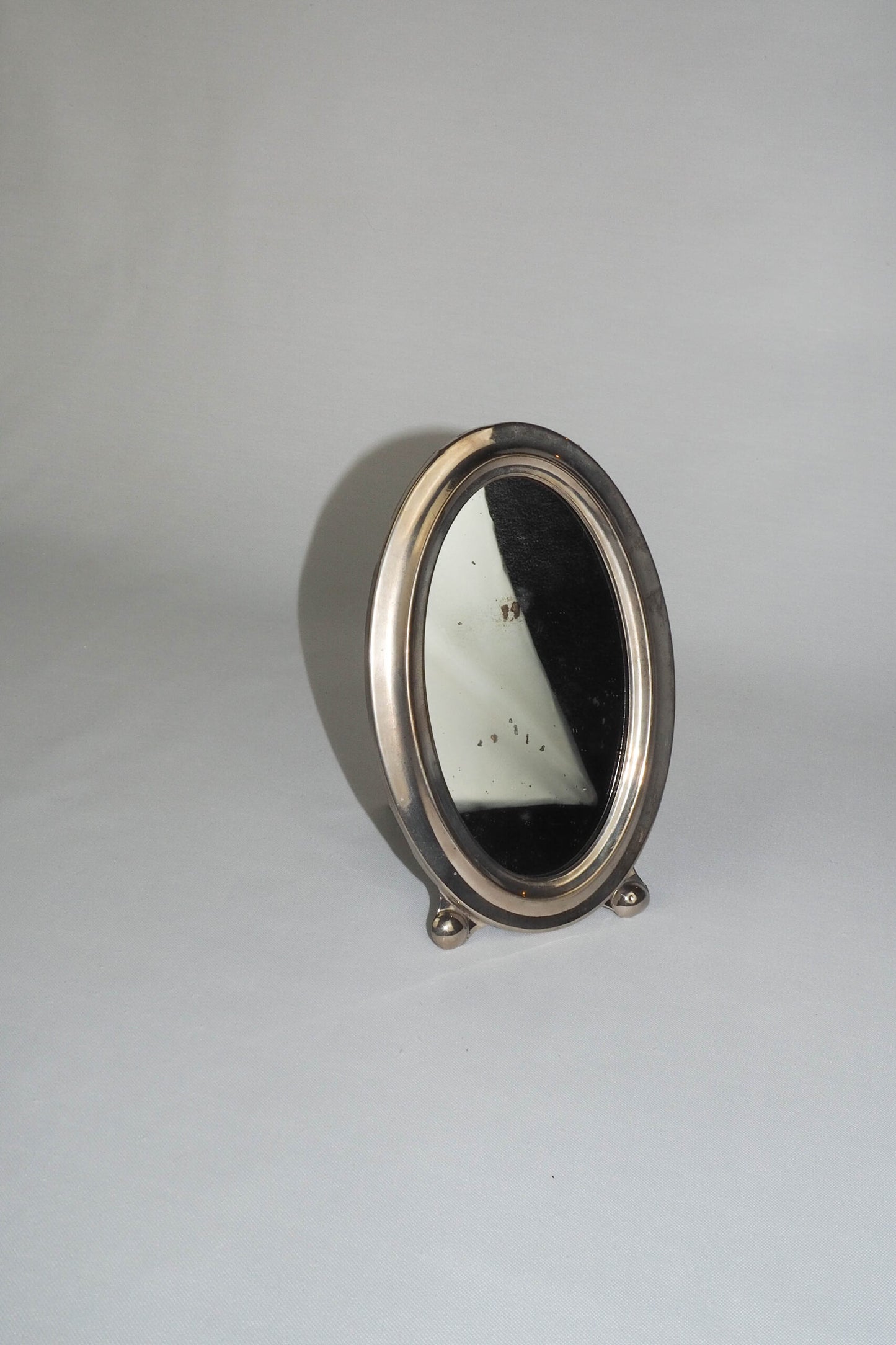 An Antique Silver Plate Framed Mirror. This antique silver plate mirror is perfect for your mantelpiece.