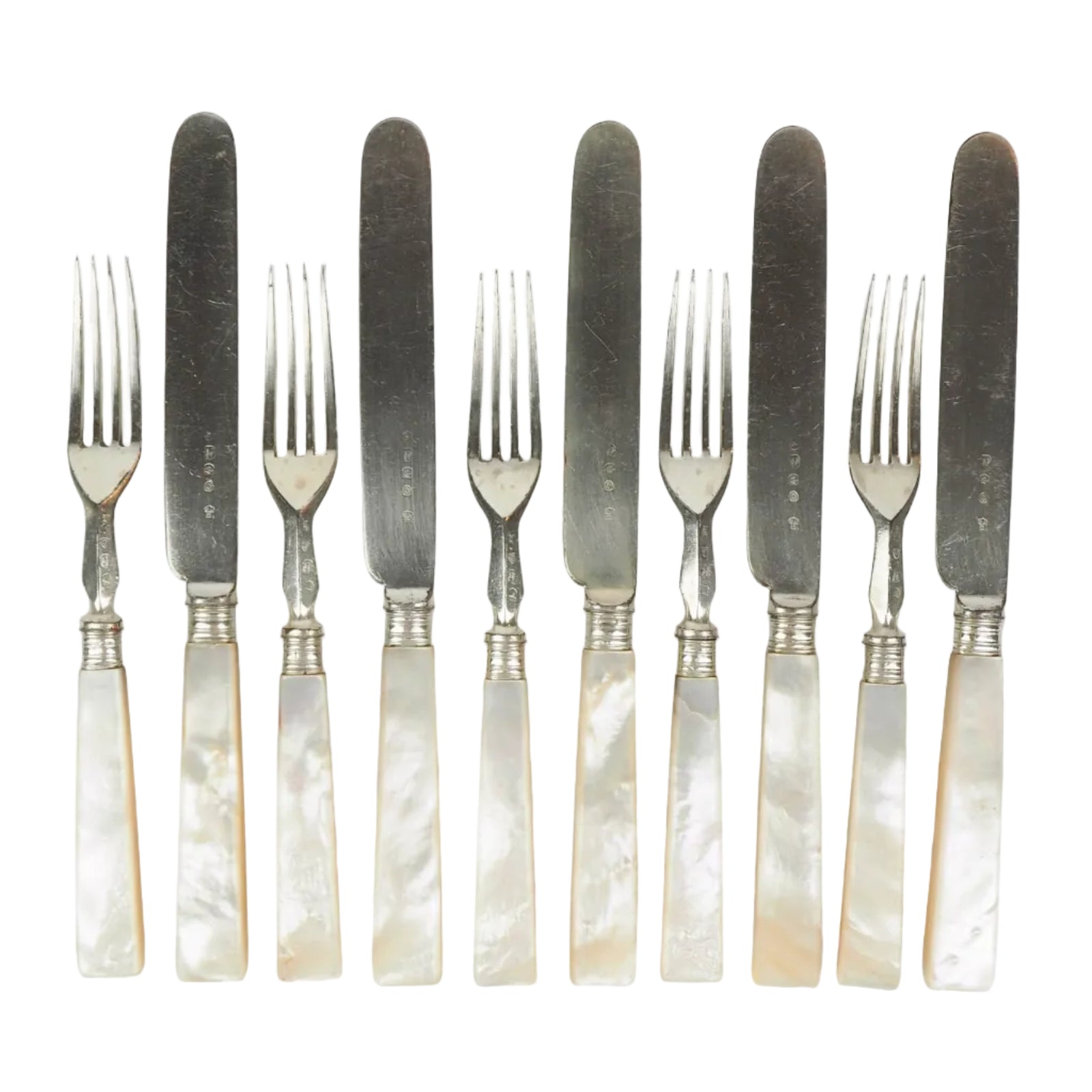 10 piece Antique Mother of Pearl Cutlery Set. The aged silver plate and mother of pearl handles give this set of knives and forks an antique look