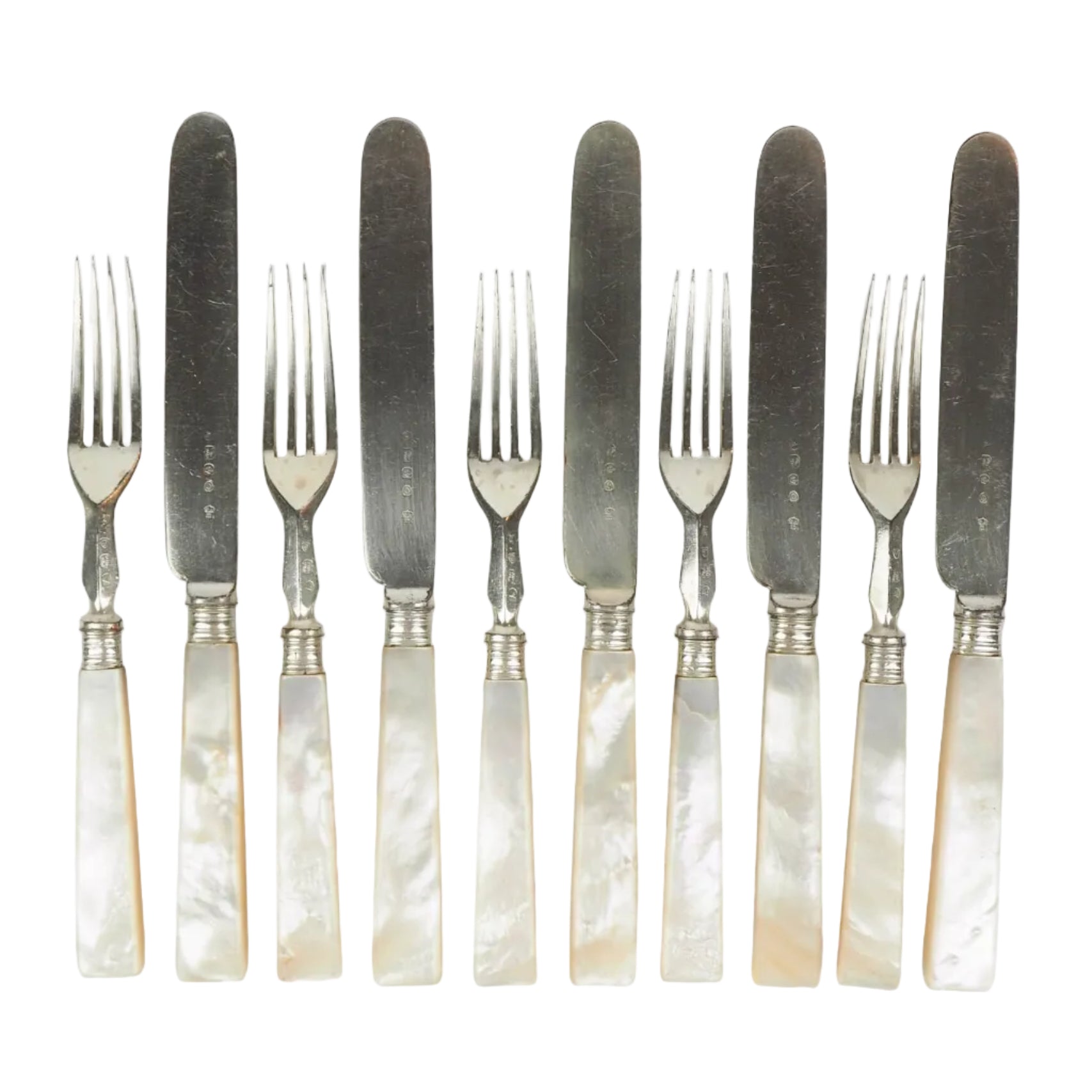 10 piece Antique Mother of Pearl Cutlery Set. The aged silver plate and mother of pearl handles give this set of knives and forks an antique look