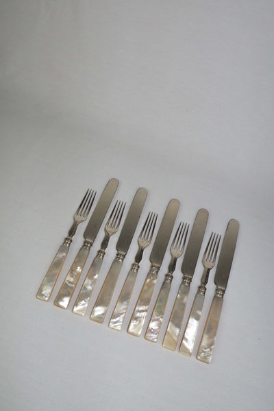 10 piece Antique Mother of Pearl Cutlery Set. The aged silver plate and mother of pearl handles give this set of knives and forks an antique look