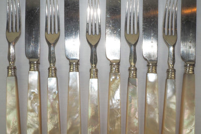 10 piece Antique Mother of Pearl Cutlery Set. The aged silver plate and mother of pearl handles give this set of knives and forks an antique look