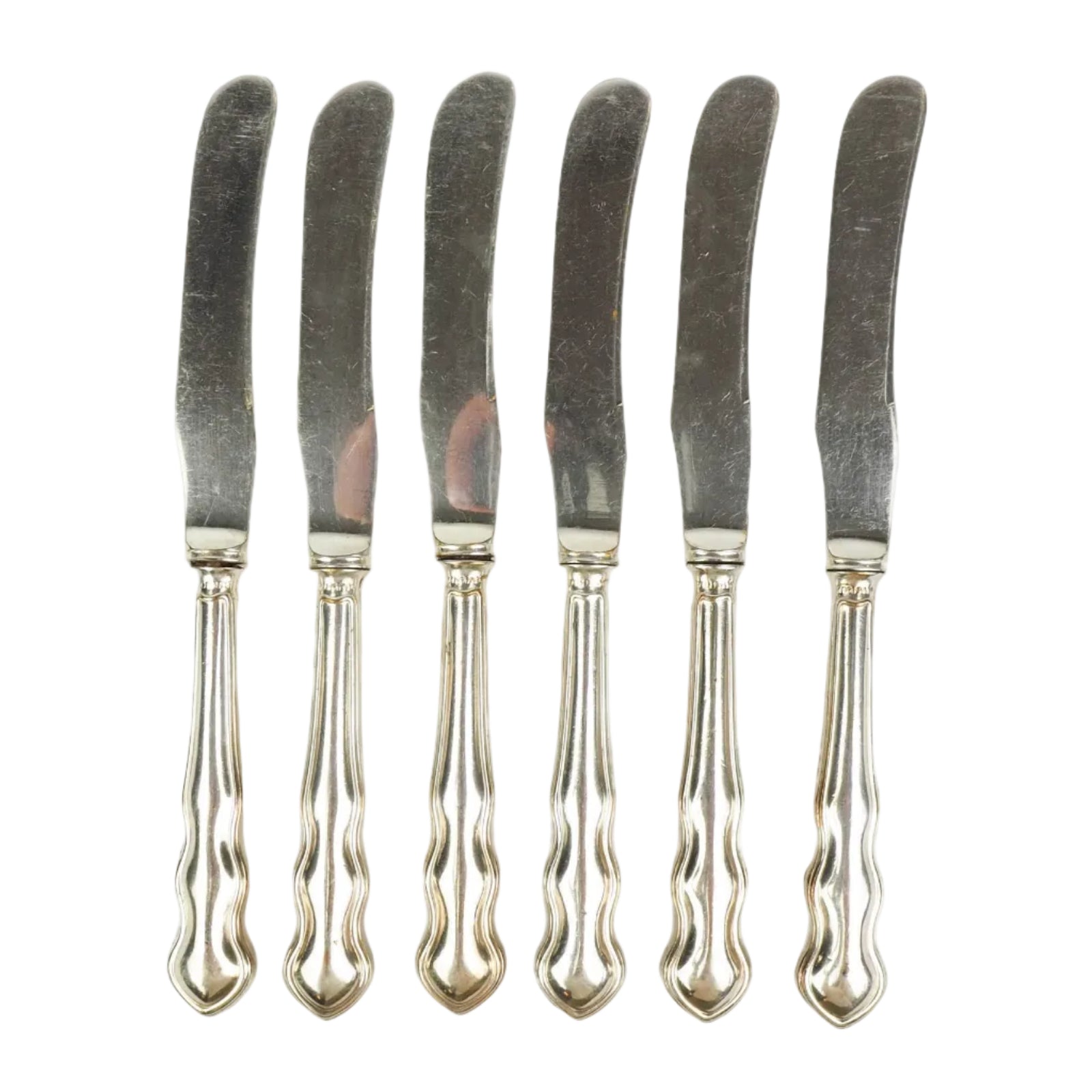 An Antique set of six Silver Plate Butter Knives with shapely tactile handles. 