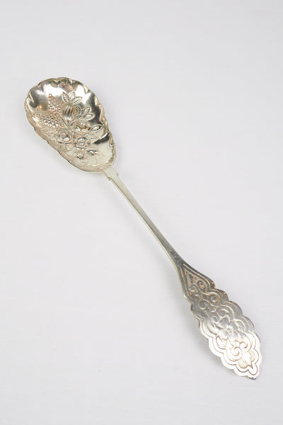 An Antique Fruit Salad Spoon With a stunning pressed pattern through the Silver Plated neck and bowl.