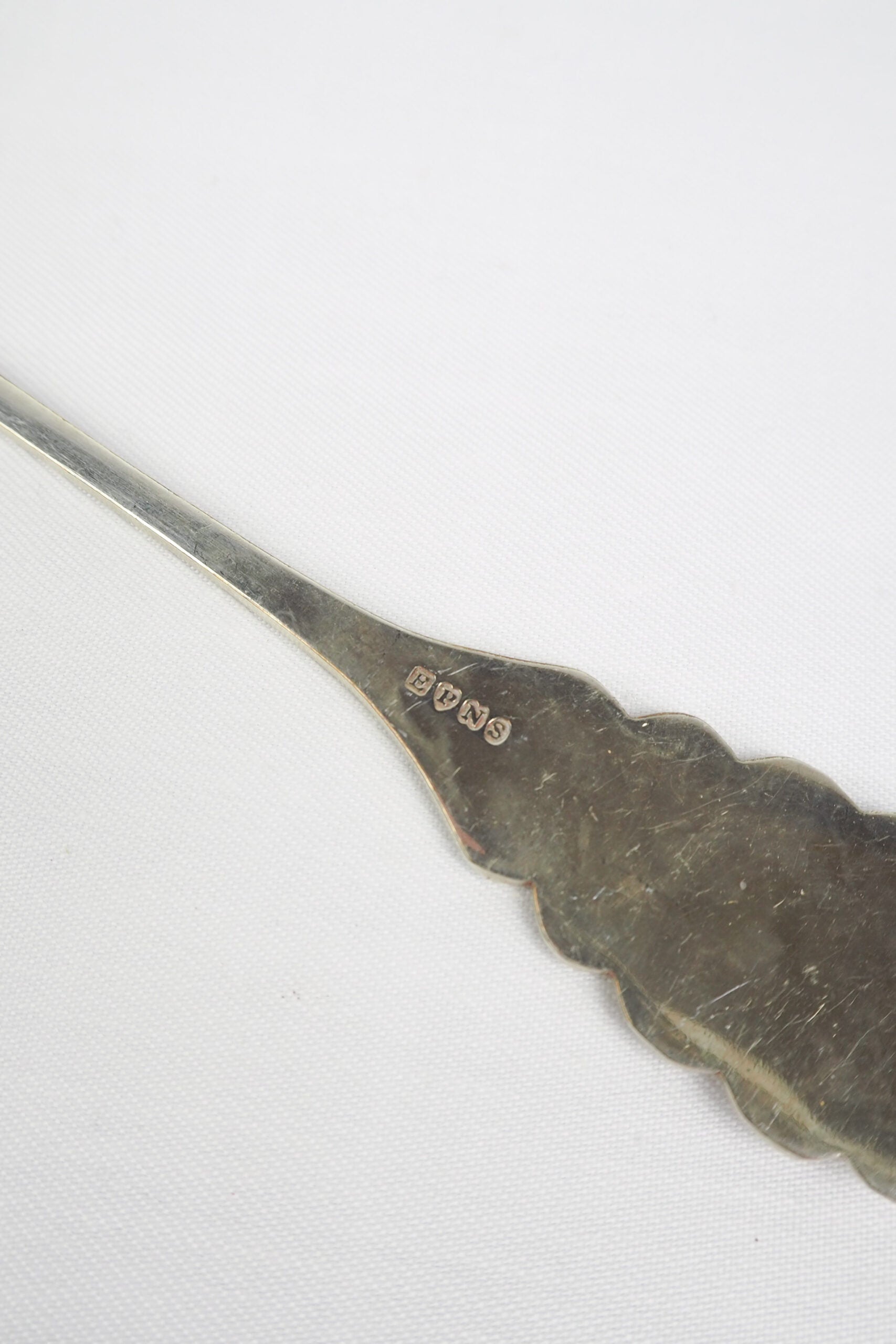 An Antique Fruit Salad Spoon With a stunning pressed pattern through the Silver Plated neck and bowl.