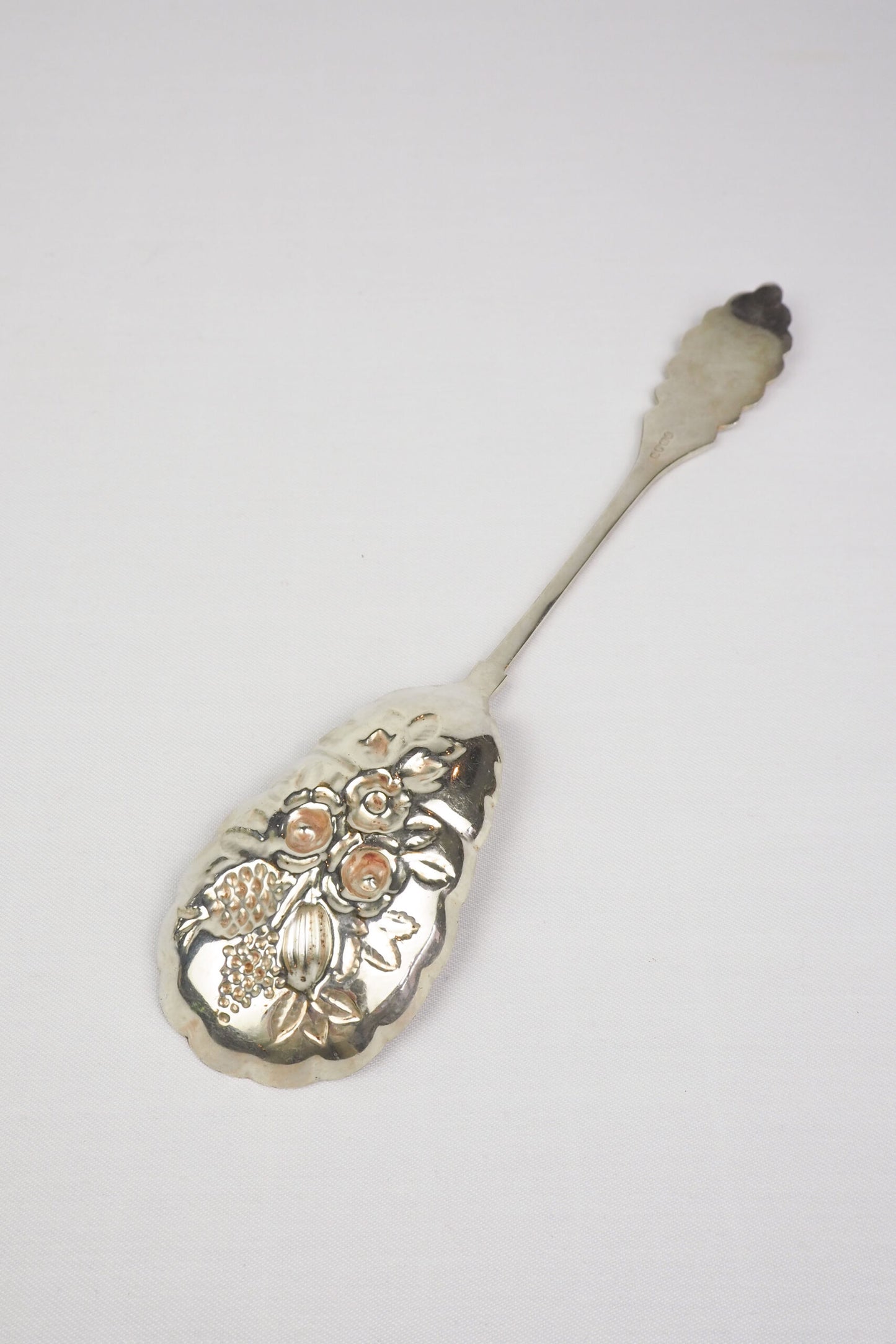 An Antique Fruit Salad Spoon With a stunning pressed pattern through the Silver Plated neck and bowl.