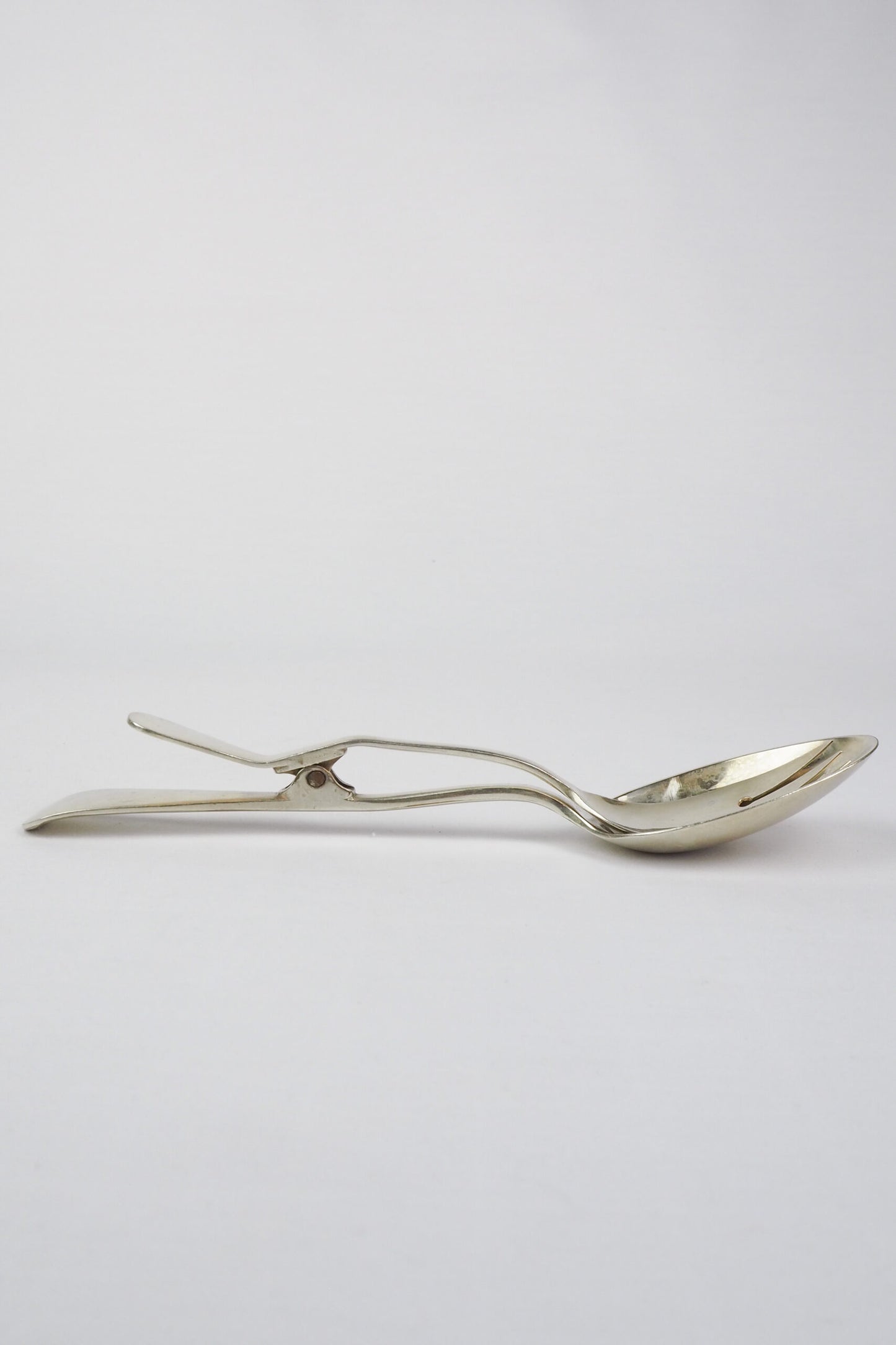 Silver Plate Hinged Salad Servers have a wonderful stone washed patina to the silver.