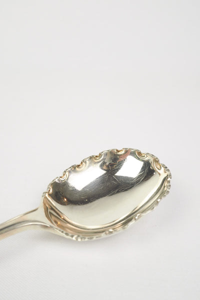 This stunning Antique Fruit Salad Spoon is the perfect piece for your kitchen. With an incredible crimped edge bowl of the spoon and a decorative handle