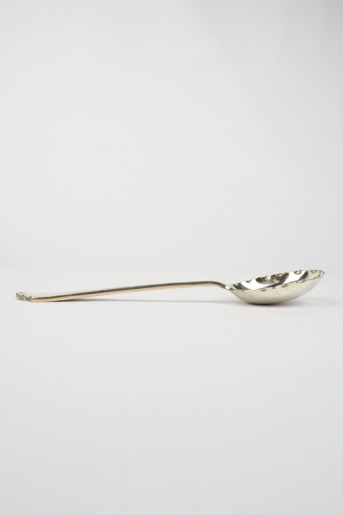 This stunning Antique Fruit Salad Spoon is the perfect piece for your kitchen. With an incredible crimped edge bowl of the spoon and a decorative handle