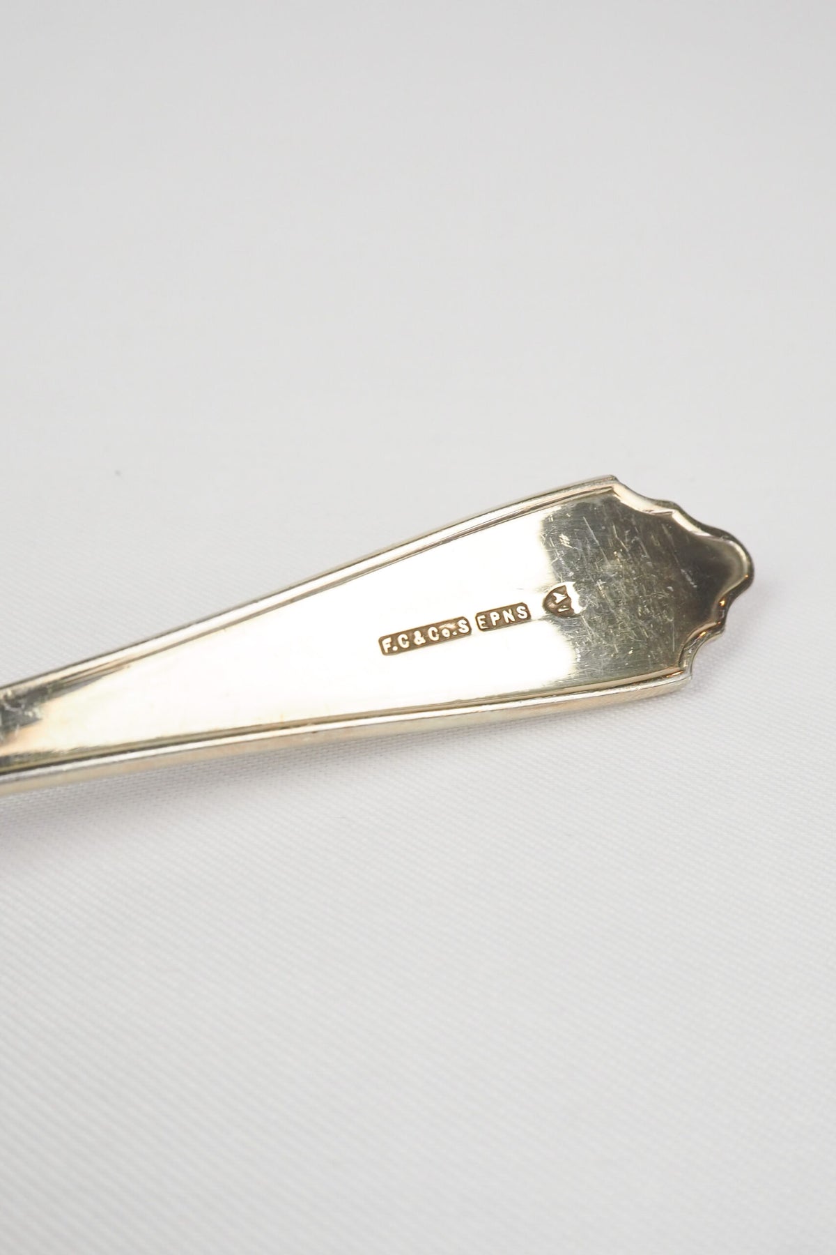 This stunning Antique Fruit Salad Spoon is the perfect piece for your kitchen. With an incredible crimped edge bowl of the spoon and a decorative handle