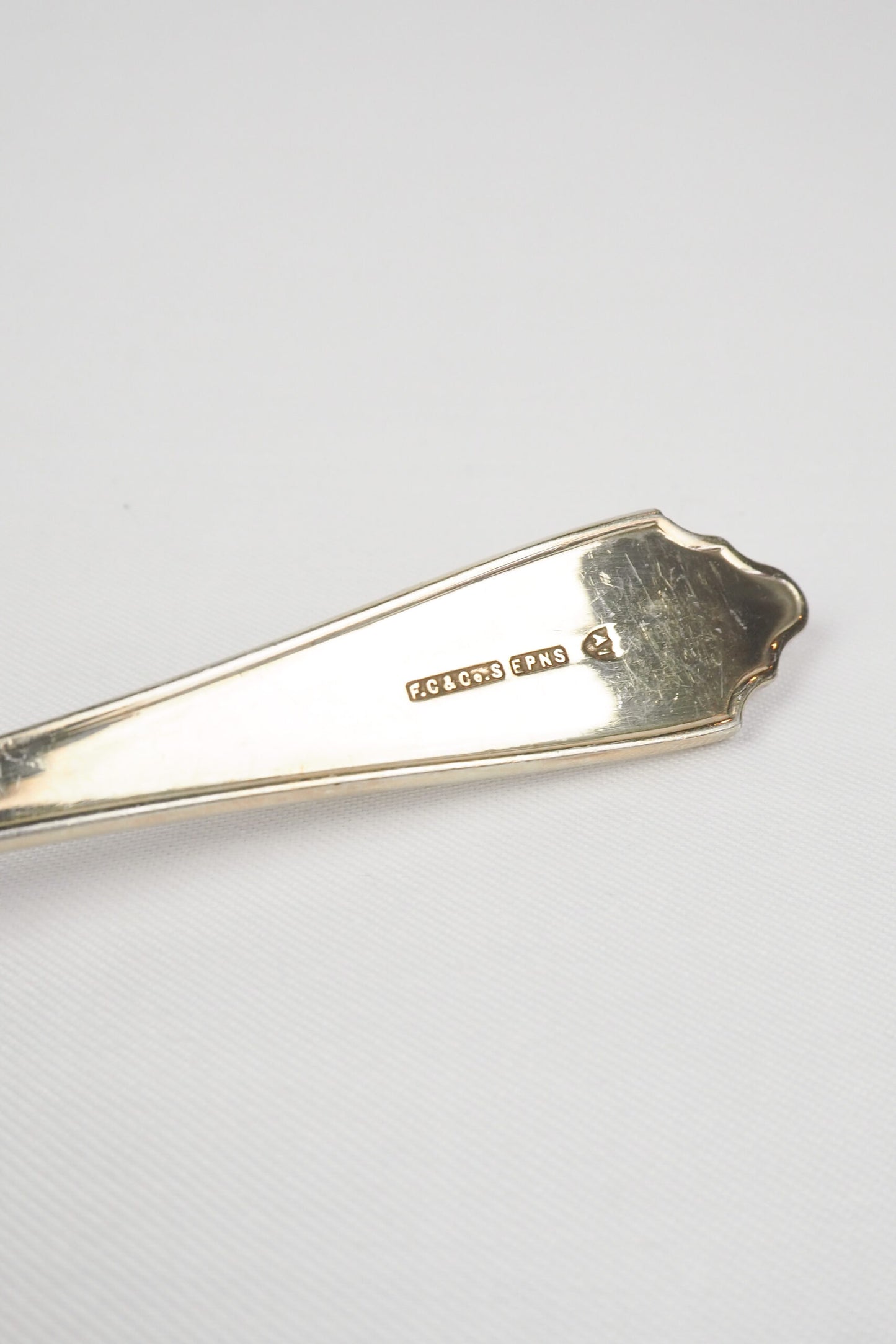 This stunning Antique Fruit Salad Spoon is the perfect piece for your kitchen. With an incredible crimped edge bowl of the spoon and a decorative handle