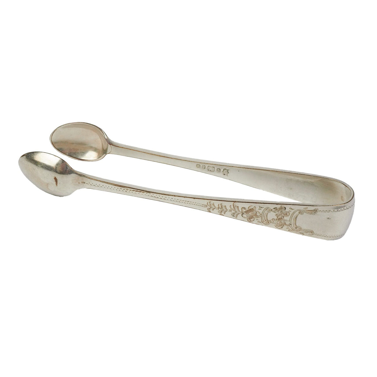 This Vintage Set of Silver Plate Sugar Tongs have a vintage stone washed patina to the silver plate and a decorative etched floral pattern. 