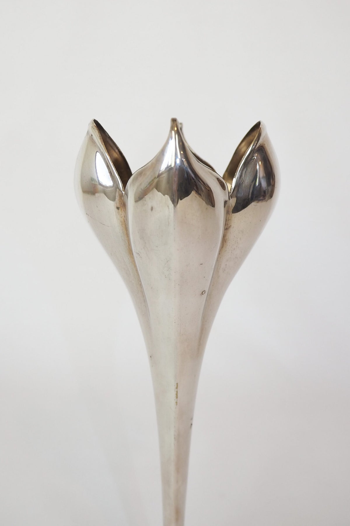 A stunning Vintage Silver Plate Flower Vase in the shape of a tulip. Tulip shaped bud vase sourced by Wildmore