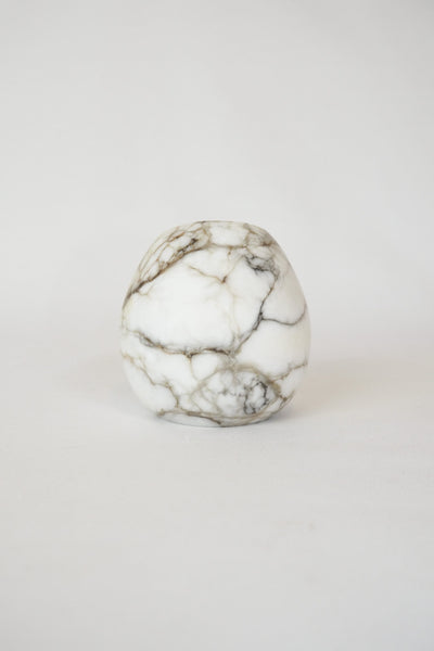 A Vintage Spherical Marble Vase with dark veins running through the white marble. Wildmore