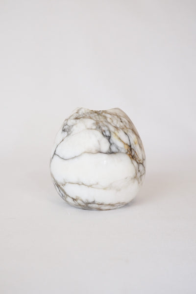 A Vintage Spherical Marble Vase with dark veins running through the white marble. Wildmore