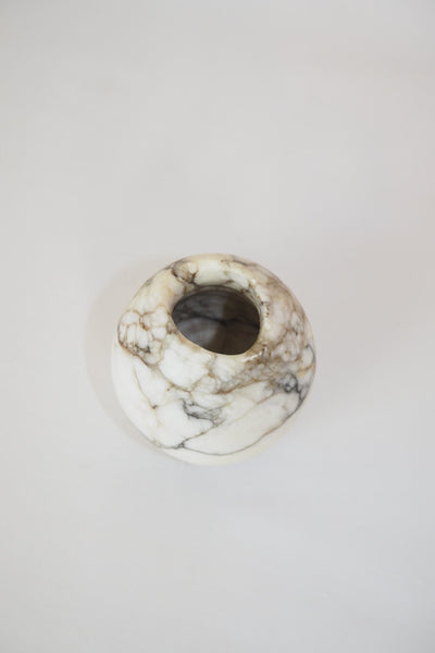 A Vintage Spherical Marble Vase with dark veins running through the white marble. Wildmore