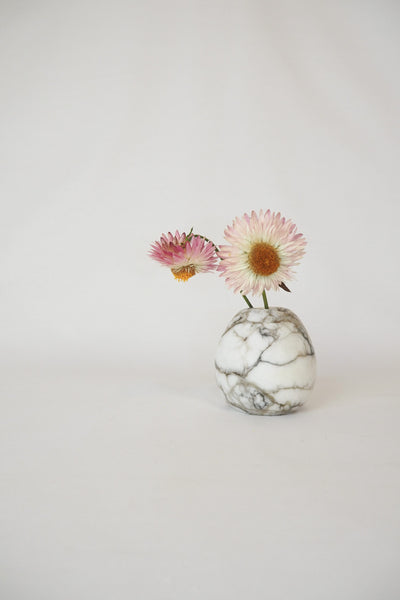 A Vintage Spherical Marble Vase with dark veins running through the white marble. Wildmore
