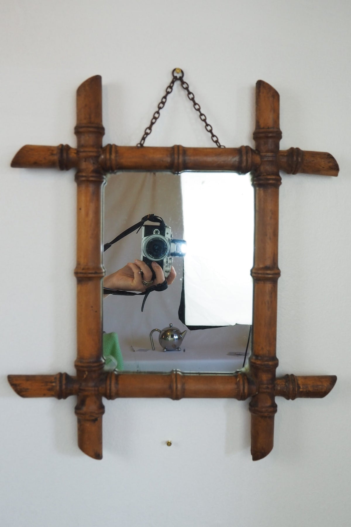 A stunning example of an early Antique French Faux Bamboo Mirror. This beautifully foxed glass is framed by a hand turned wooden frame.