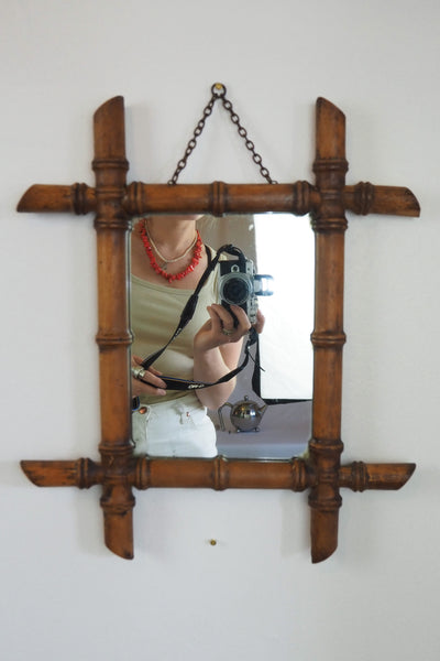 A stunning example of an early Antique French Faux Bamboo Mirror. This beautifully foxed glass is framed by a hand turned wooden frame.