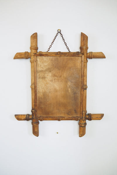 A stunning example of an early Antique French Faux Bamboo Mirror. This beautifully foxed glass is framed by a hand turned wooden frame.