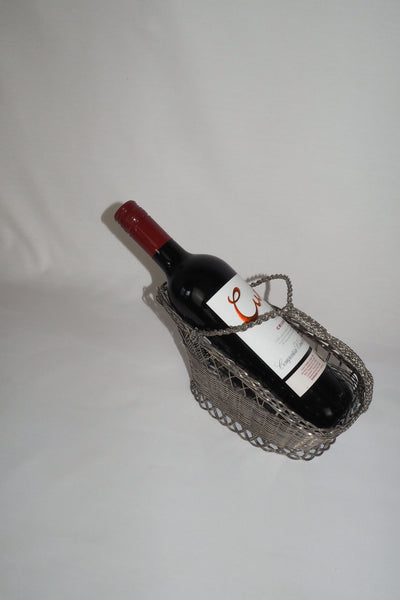This Vintage Silver Plate Wine Bottle Holder is a great centrepiece for your party. The elegant style gives this silver plate wine server timeless appeal.