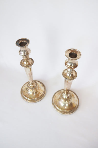 Stunning Pair of Georgian Silver Plate Candlesticks. This stunning pair of tall antique candle sticks are perfect for your coffee table or dinner party tablescape.