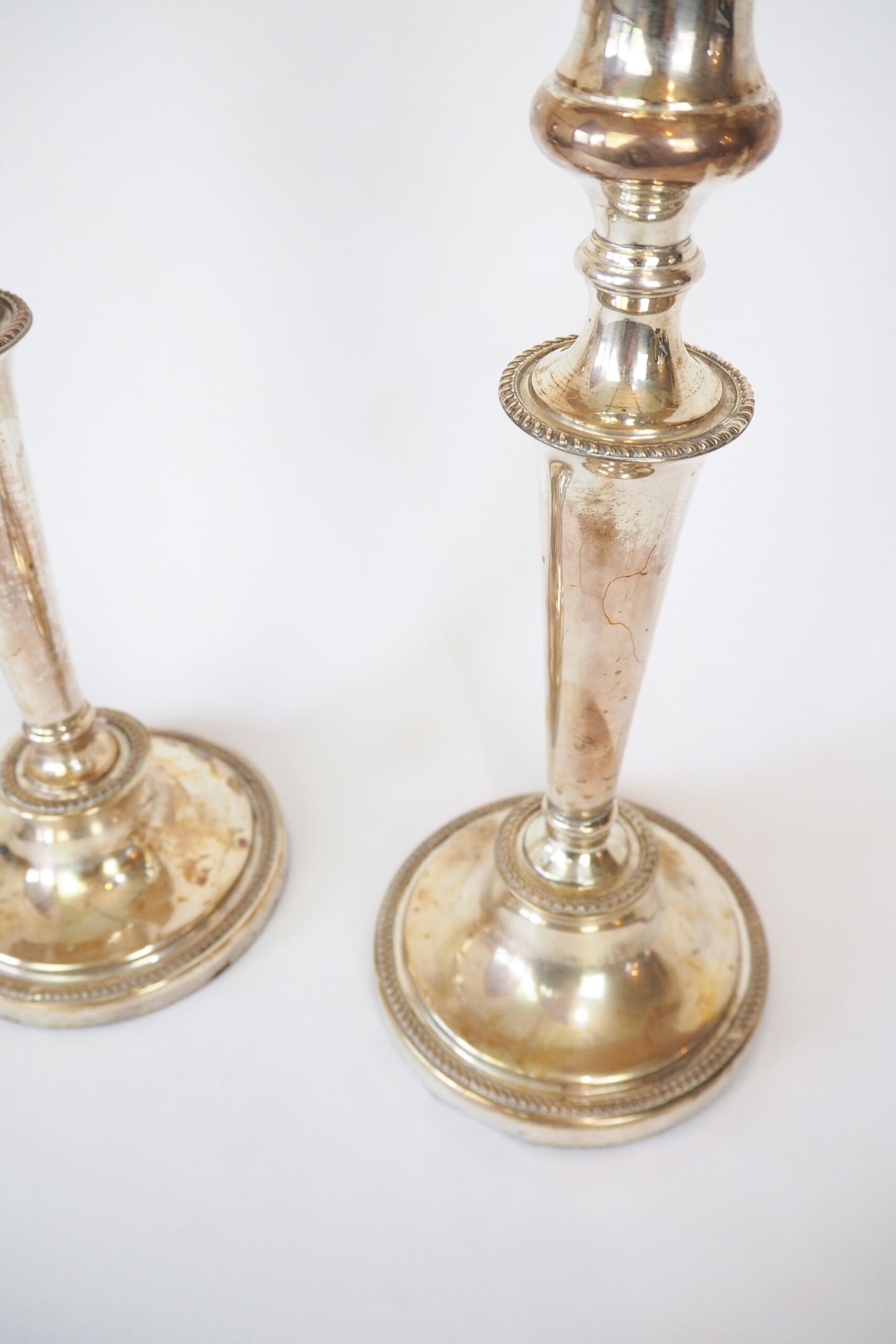 Stunning Pair of Georgian Silver Plate Candlesticks. This stunning pair of tall antique candle sticks are perfect for your coffee table or dinner party tablescape.