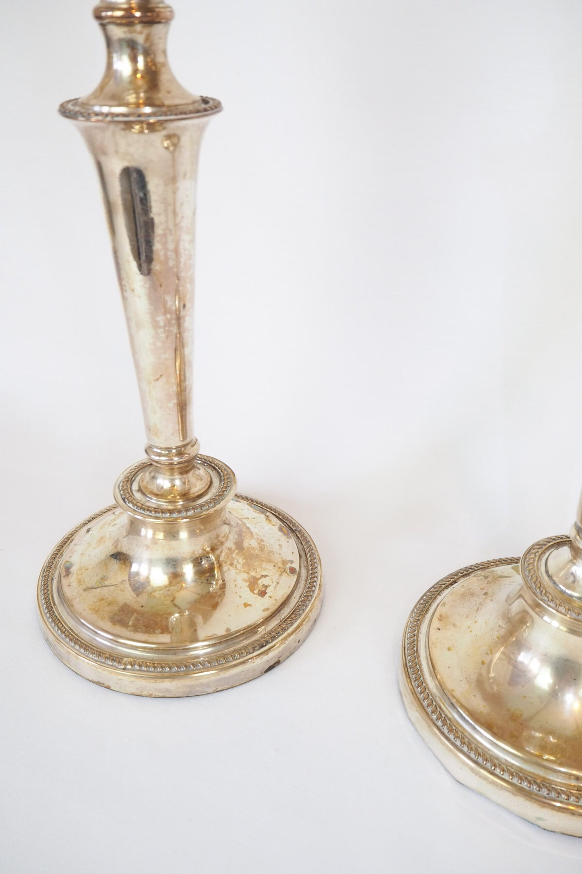 Stunning Pair of Georgian Silver Plate Candlesticks. This stunning pair of tall antique candle sticks are perfect for your coffee table or dinner party tablescape.