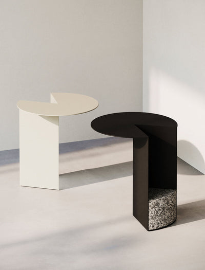 PAC Side Table - 700 with round aluminum top and solid granite base, available in black and white colors.