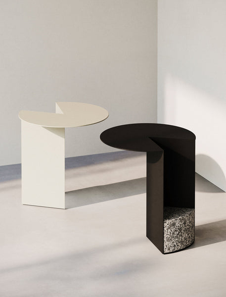 PAC Side Table - 700 with round aluminum top and solid granite base, available in black and white colors.