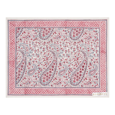 A hand-block printed pink and white floral patterned table mat.