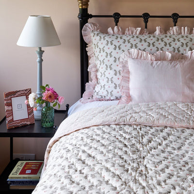 Single and cot size duvet covers in our exclusive pretty pale pink bunny block printed cotton with coordinating striped pink reverse and ruffle trim.