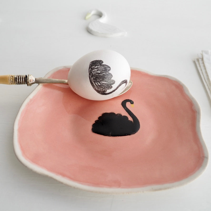 Pink ceramic plate with black swan