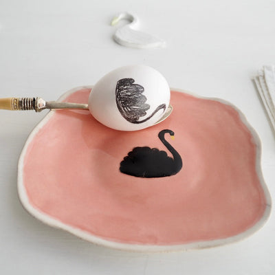 Pink ceramic plate with black swan