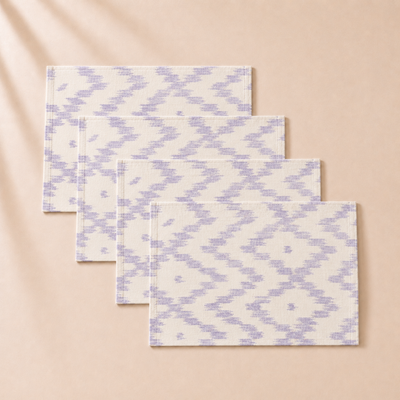 Set of fourpatterned placemats  on a beige background