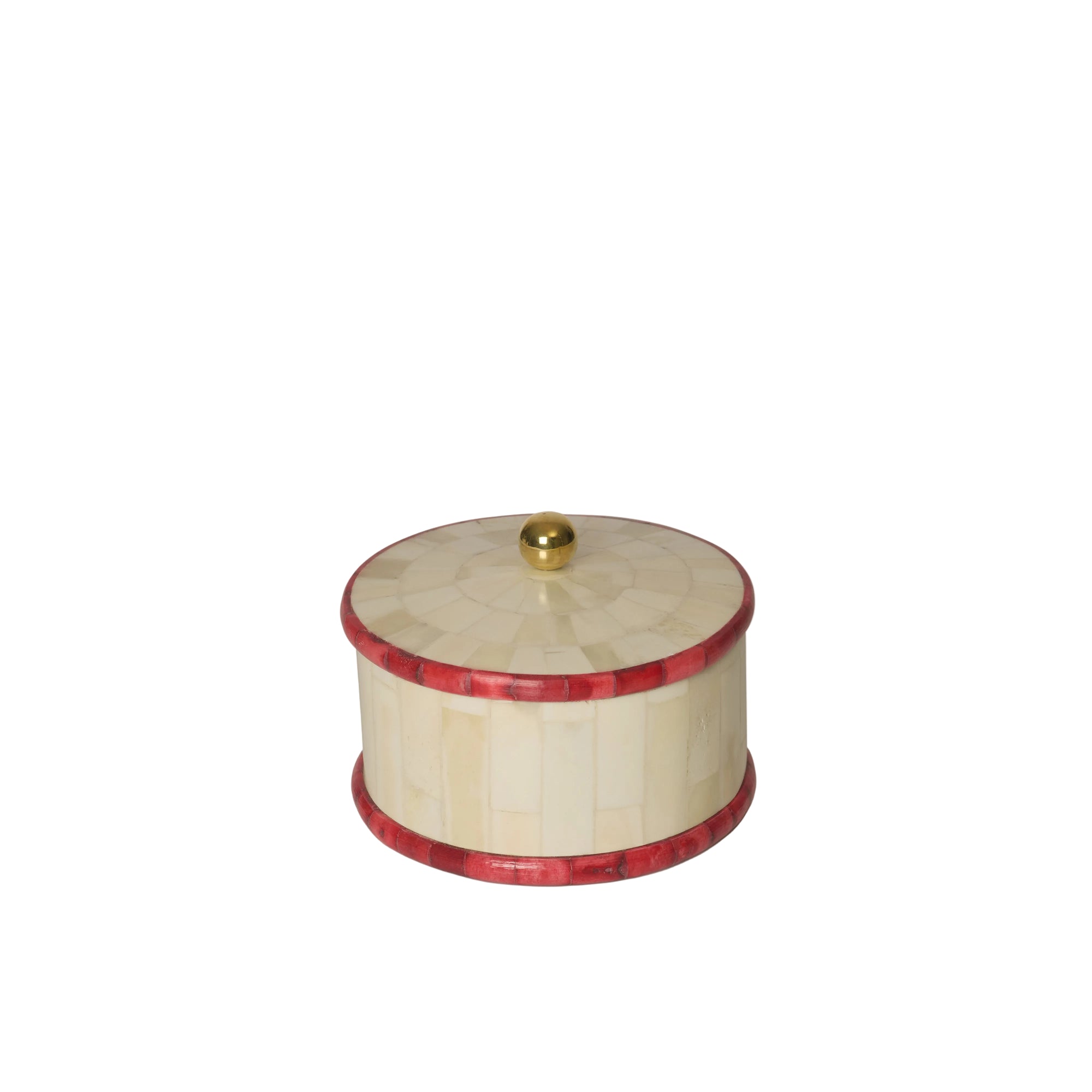 Round decorative box with red inlay and gold knob on a white background