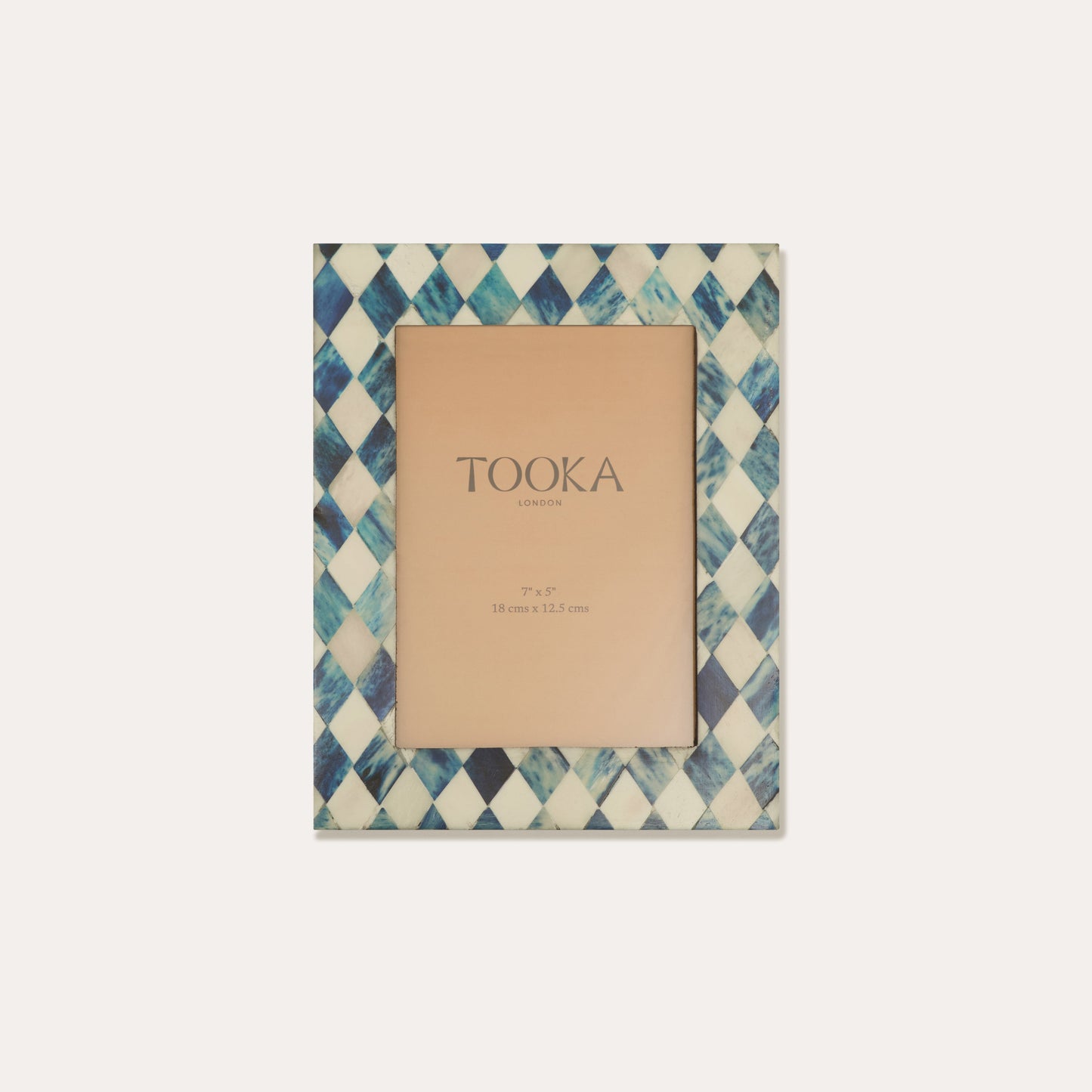 Patterned small picture frame with 'Tooka' branding on a white background