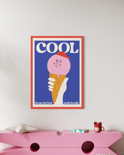 A framed poster featuring a cute illustration of a pink ice cream cone with the word 'COOL' above it. Colourful art work for kids bedroom. 