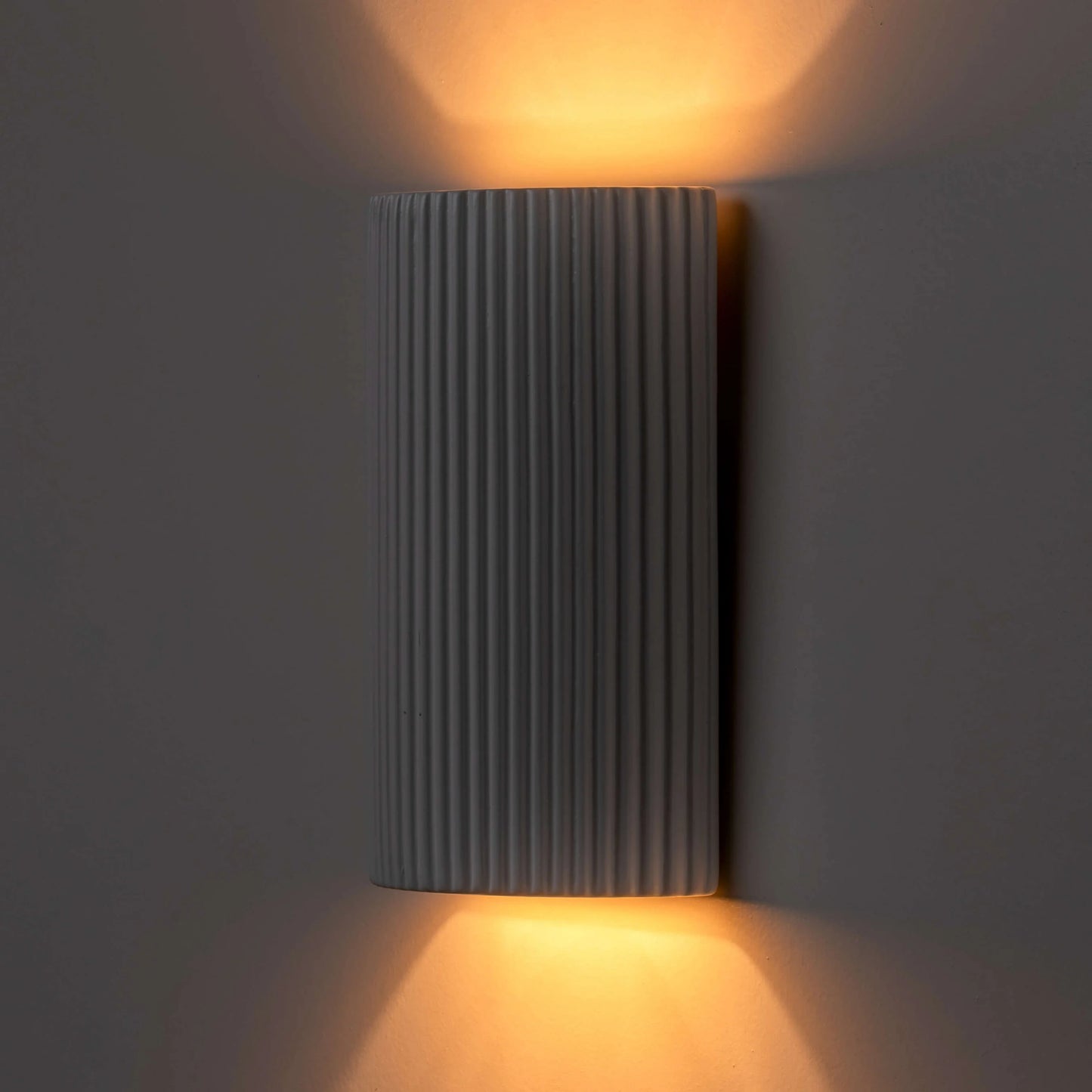 White ribbed ceramic pillar wall light