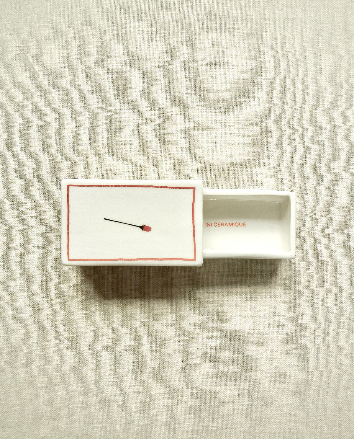 Ceramic matchbox with hand-drawn rose illustration