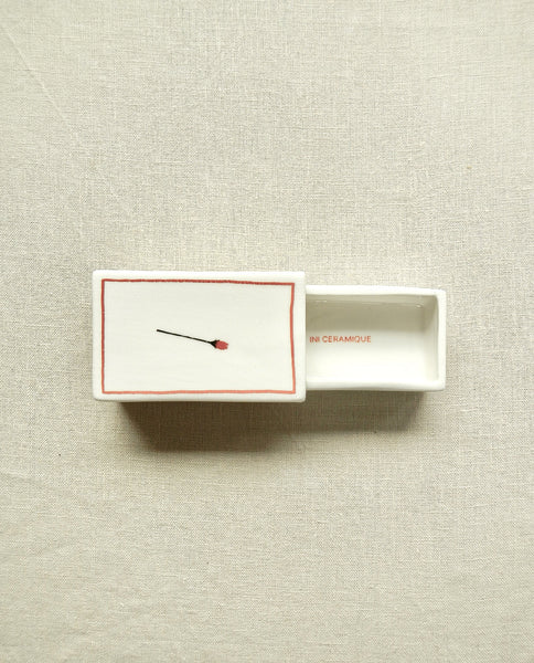 Ceramic matchbox with hand-drawn rose illustration