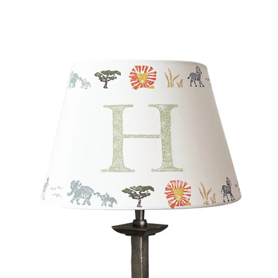 Studio Zef product image of a personalised kids safari lampshade with letter H. Empire lampshade featuring safari animals, perfect as a boys lampshade, kids lighting or presents for new parents.