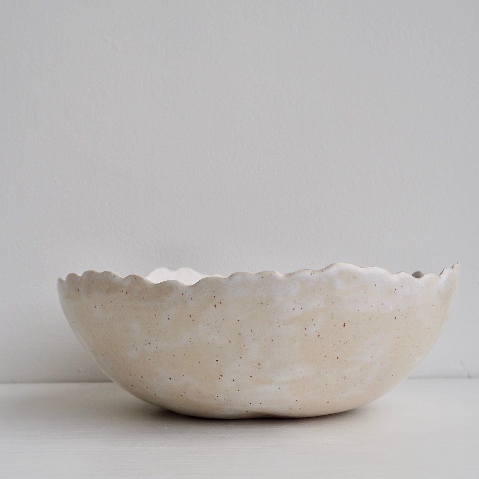 Handmade Cream/White Speckled Scalloped Ceramic Serving Bowl.