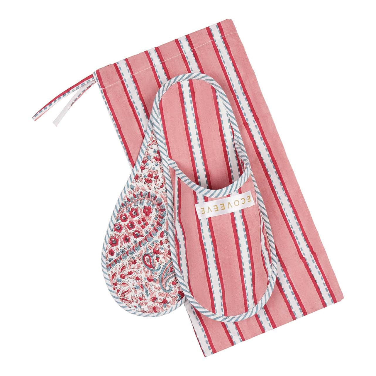 A pair of hand block-printed pink bedroom slippers with white floral design, displayed on a striped background.