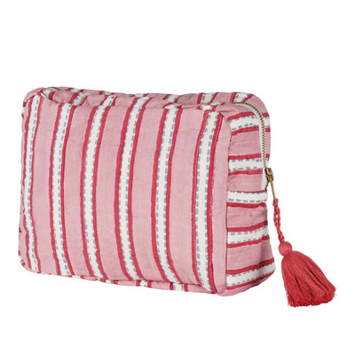A pink and white striped hand block-printed vanity pouch with a zipper and a tassel.