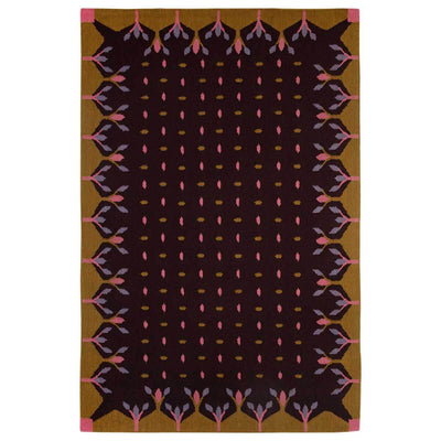 Dark brown and mustard Hedgerow rug handwoven with mustard yellow border and decorative motifs.